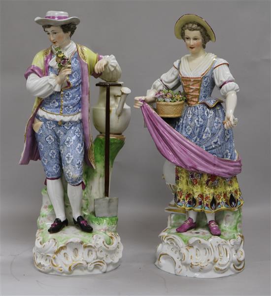 In the manner of Augustus Rex. A pair of Helena Wolfshon Dresden porcelain figures of gardeners, 36cm